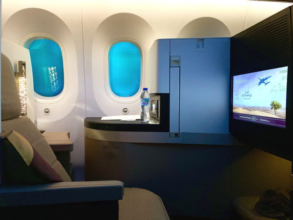 Etihad business class seat next to a window